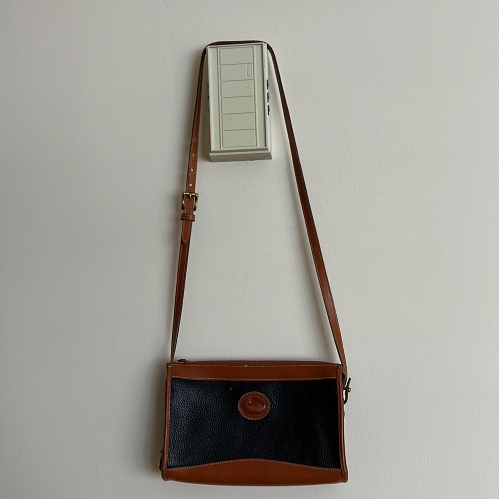 Dooney & Bourke:  crossbody or shoulder purse. Black and brown.l colors.